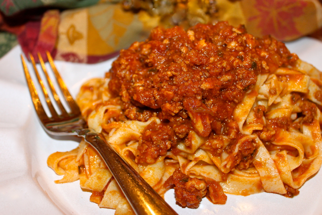 Fresh homemade tagliolini made with a chitarra pasta cutter at a