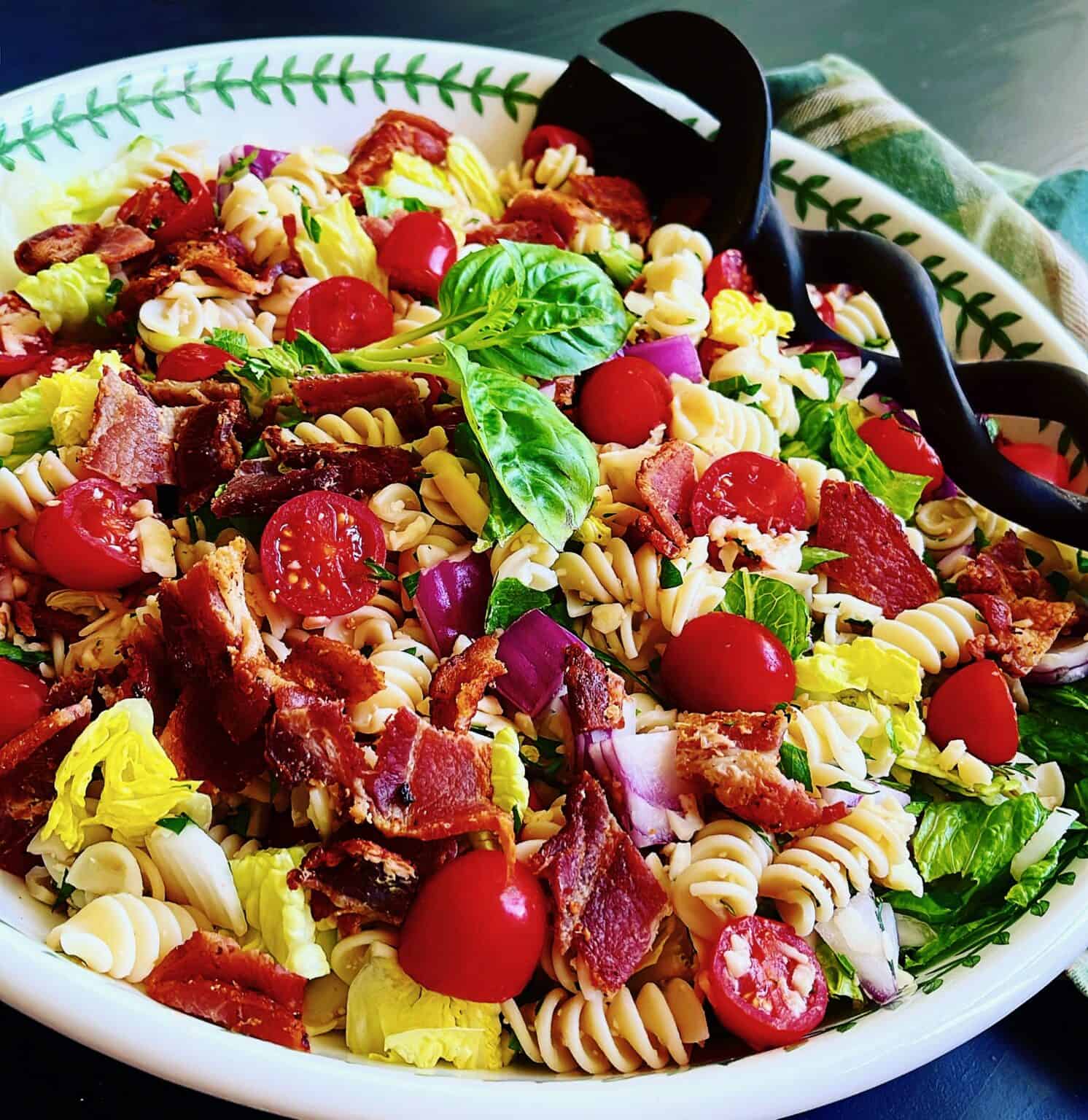 A colorful Italian BLT pasta salad featuring rotini, crispy bacon, and fresh tomatoes