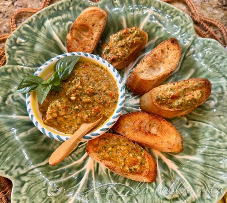 IMG_2382 2 | La Bella Vita Cucina Appetizer plate with crusty crostini and a chunky herb-garlic dip garnished with fresh basil leaves